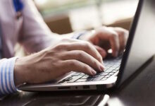 Man in Suit Typing