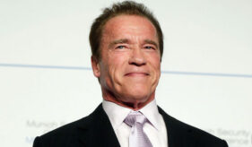 Arnold Schwarzenegger Smiling Black Suit White Tie