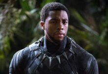 Chadwick Boseman Holding Helmet Black Panther