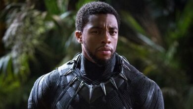 Chadwick Boseman Holding Helmet Black Panther