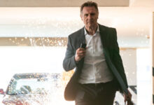 Liam Neeson In Front Of Car