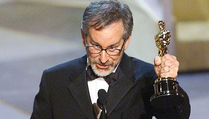 Steven Spielberg holds the Oscar