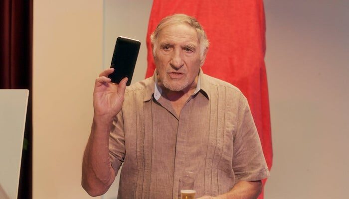 Judd Hirsch Holding An Iphone Imordecai
