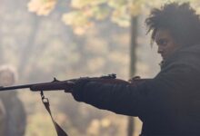 Shailyn Pierre Dixon Holding Rifle The Well