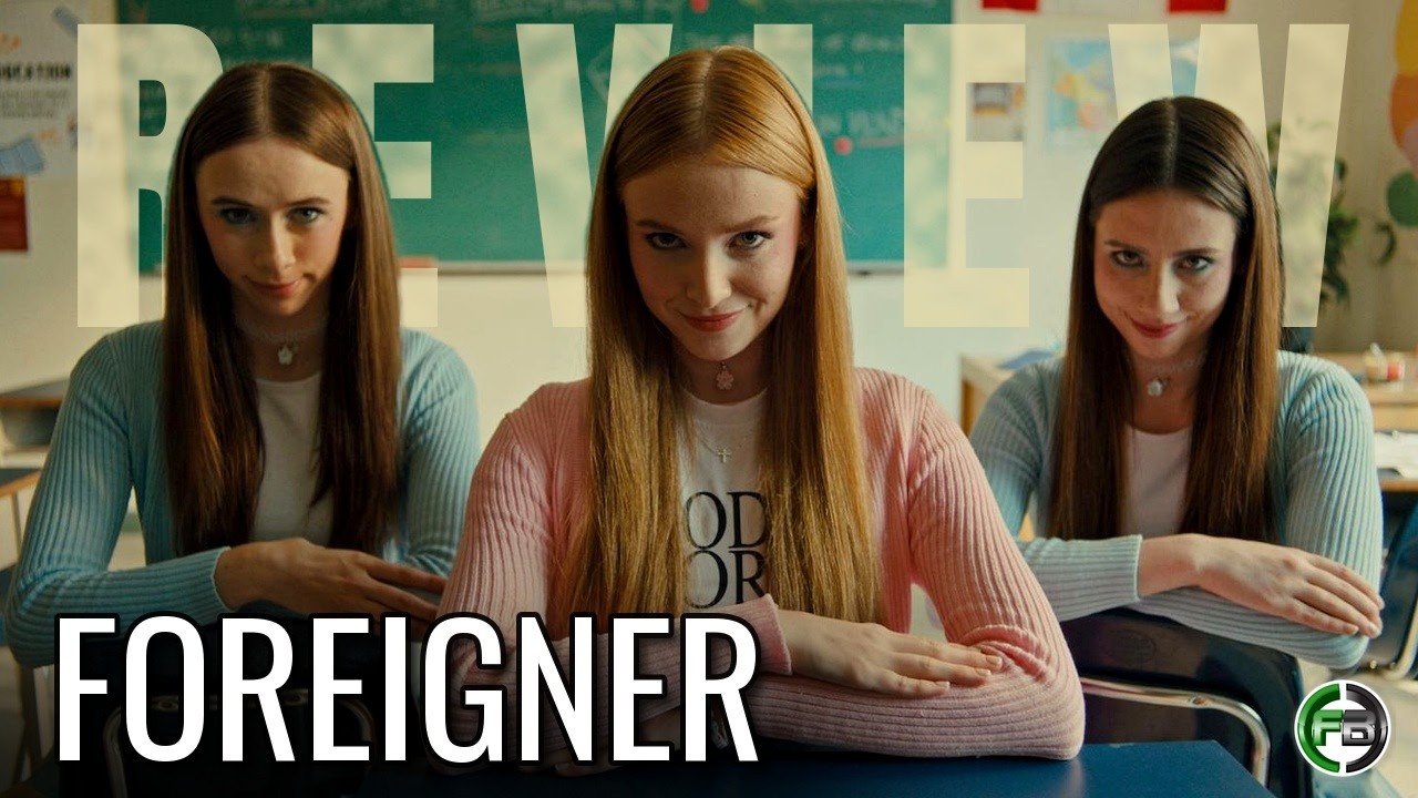 Video Movie Review: FOREIGNER (2025): Its Sharpest Cultural Satire Survives an Underdeveloped Finale